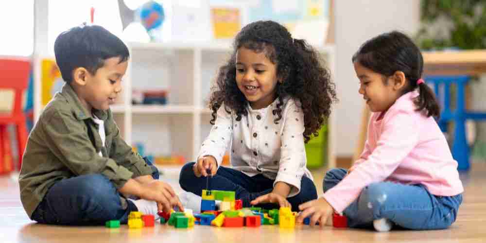 young children playing with blocks demonstrating early learning