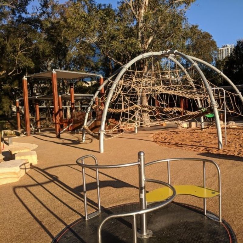 climbing frame and wooden structures at paperbark playground parramatta